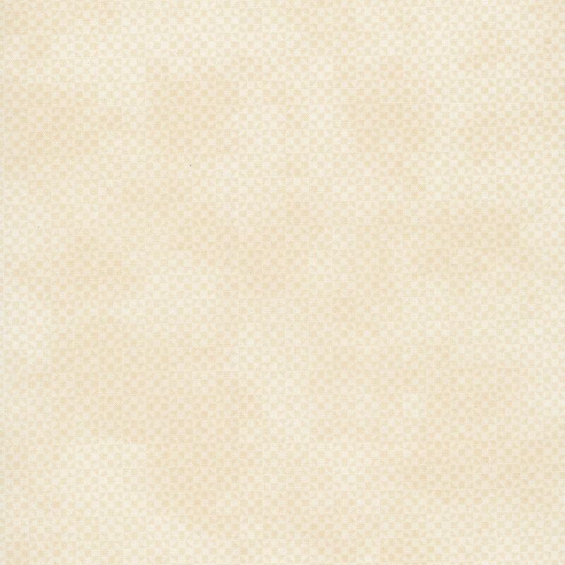 Mottled, tonal cream fabric with a small geometric pattern