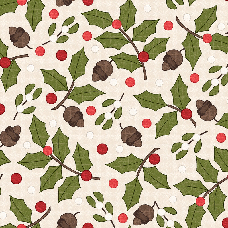 Holly, mistletoe, and acorns tossed on a textured cream background