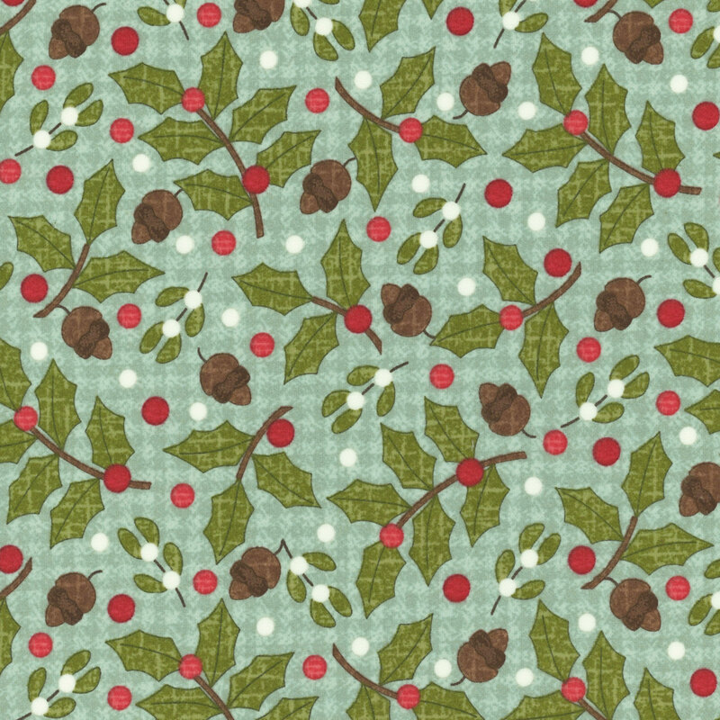 Holly, mistletoe, and acorns tossed on a textured teal background