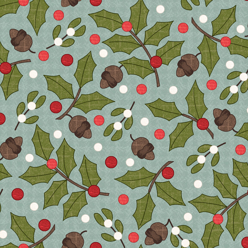 Holly, mistletoe, and acorns tossed on a textured teal background
