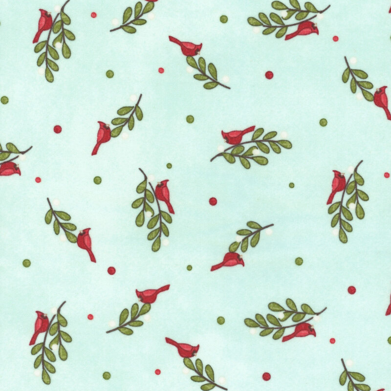 Cardinals resting on mistletoe, red dots, and green dots scattered on a textured aqua background.
