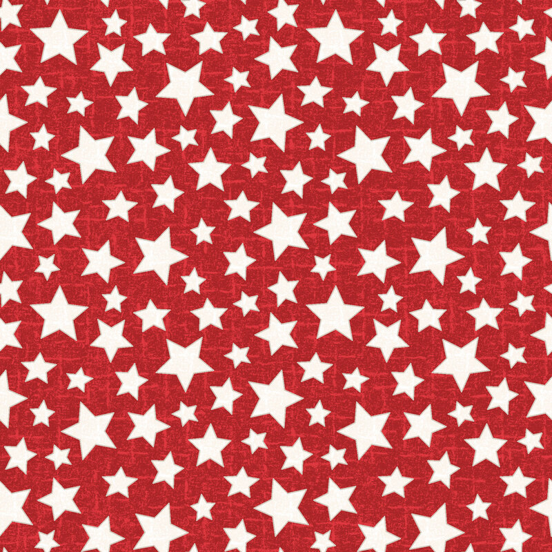 White stars with brown outlines tossed on a textured red fabric