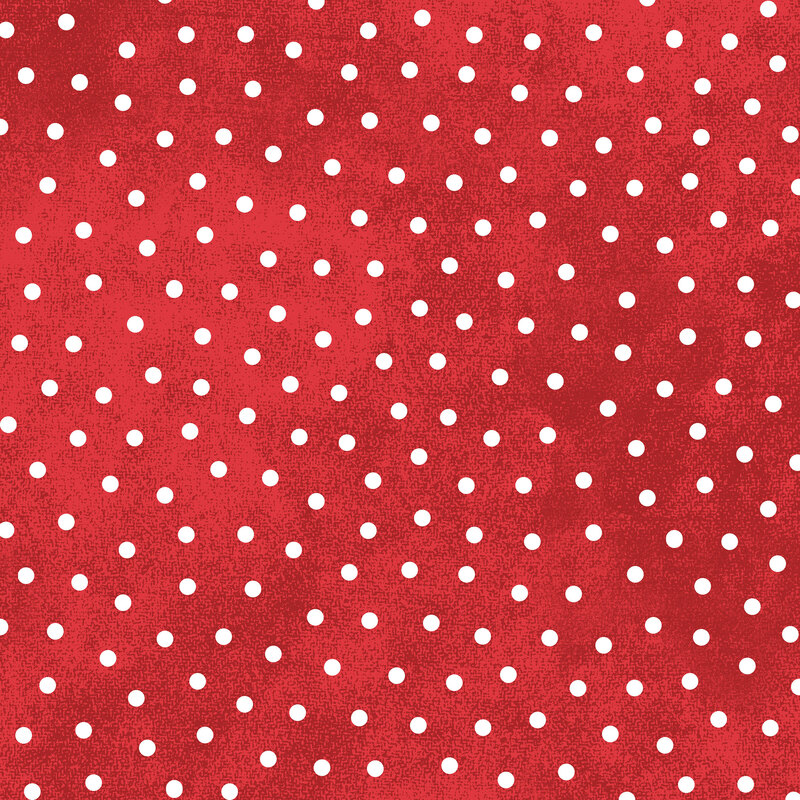 white polka dots scattered on a textured cranberry red background