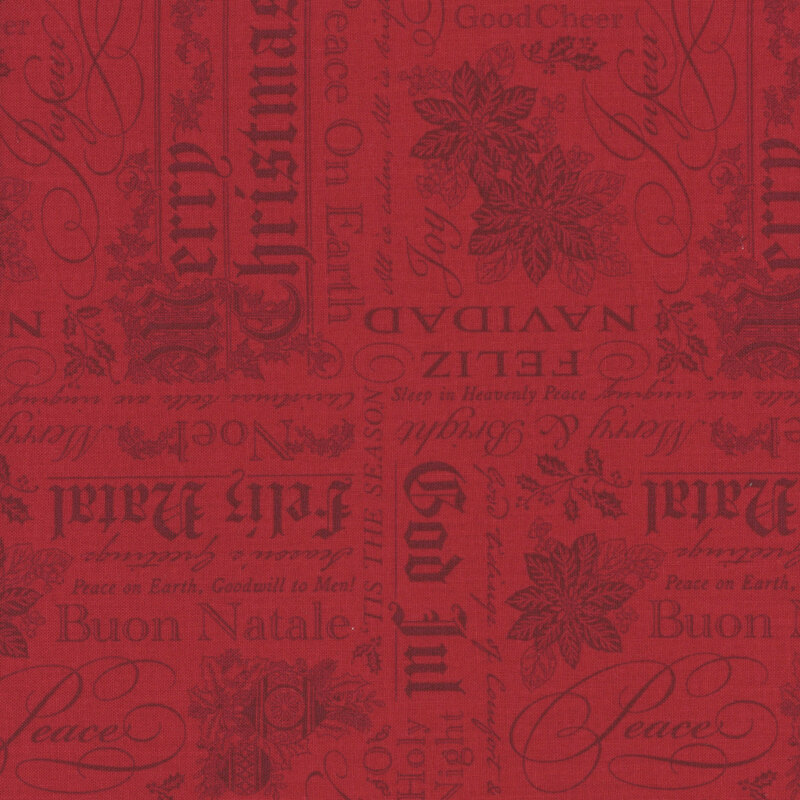 Ruby red fabric featuring stylized Christmas greetings in multiple languages with ornaments, poinsettias, and holly.