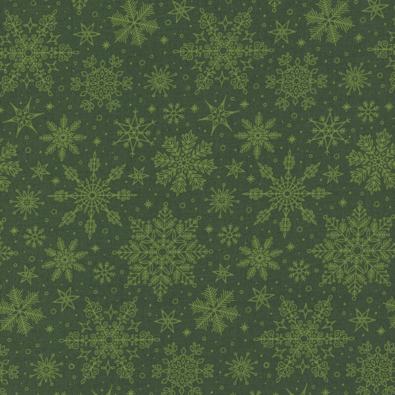 Pine green fabric tossed with ornamental snowflakes.