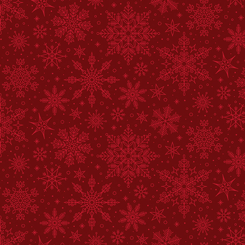 Ruby red fabric tossed with ornamental snowflakes.