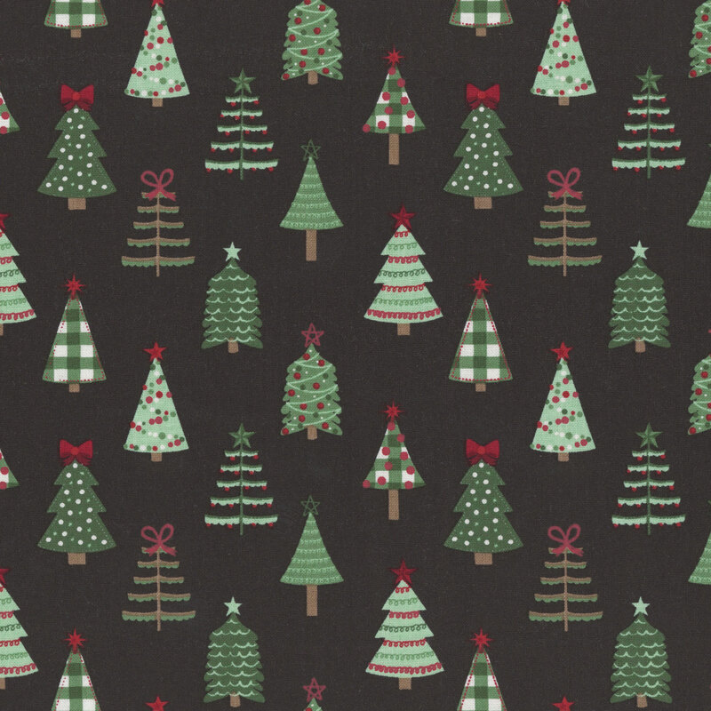A black fabric with various stylized christmas trees. 