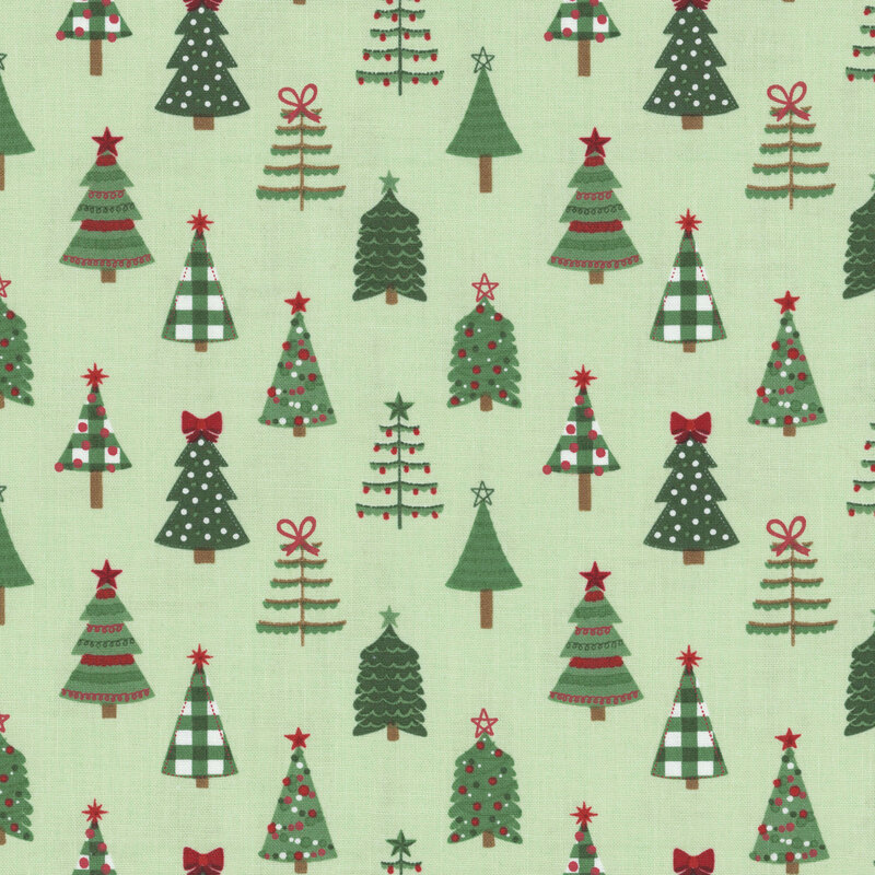 A mint fabric with various stylized christmas trees. 