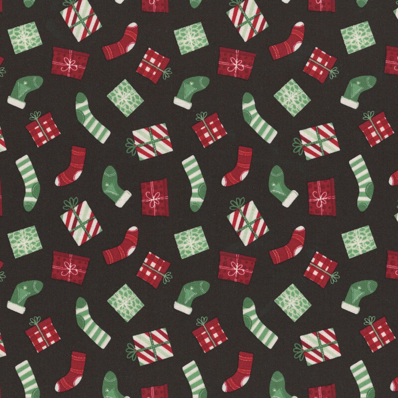 A black fabric with tossed stockings and christmas presents. 