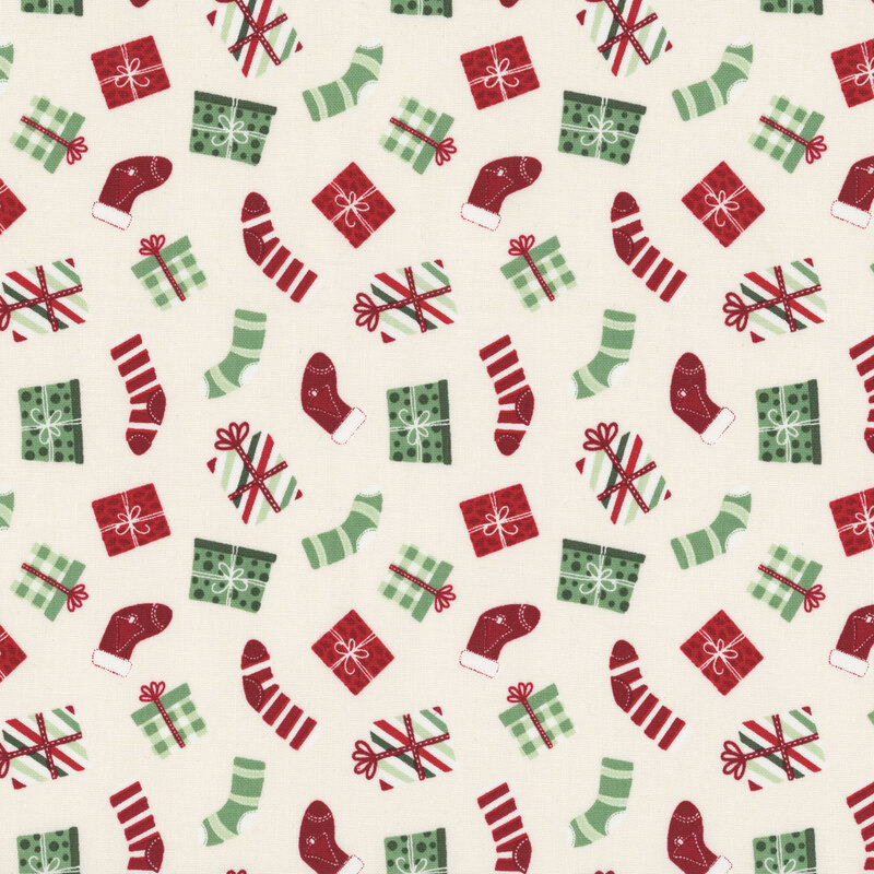 A cream fabric with tossed stockings and christmas presents. 