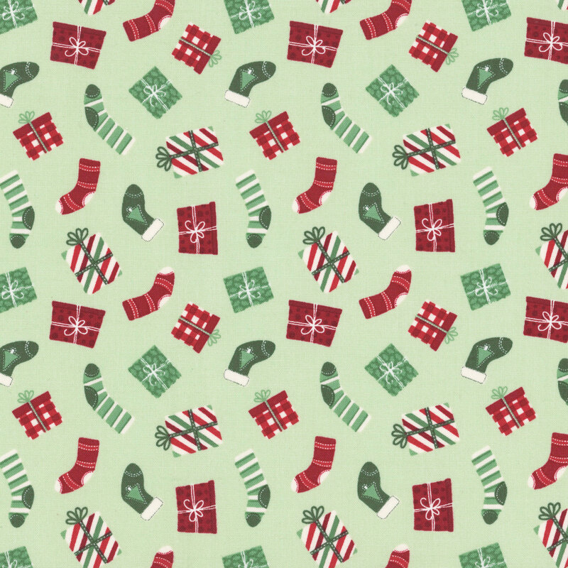 A mint fabric with tossed stockings and christmas presents. 