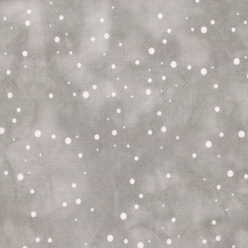 A sample image of the Fabric Flair Snow On Hazy Gray 14ct Aida Cloth with a mottled gray background and round white snowflake print.
