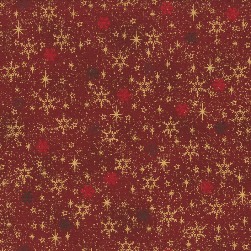 Mottled red fabric with scattered snowflakes and stars with gold metallic accents.