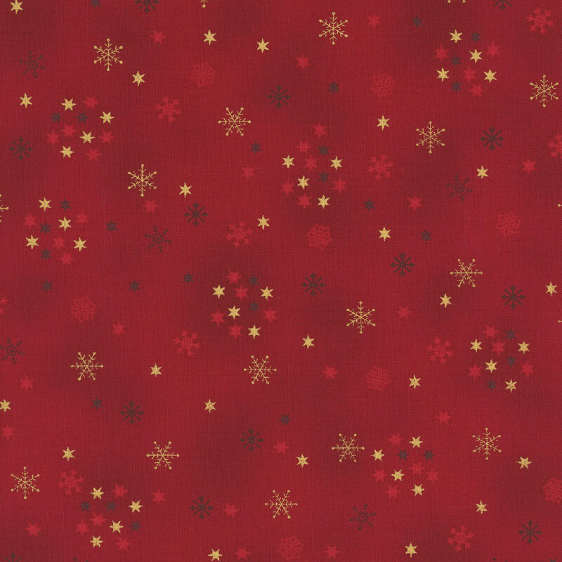 Mottled red fabric with tiny scattered stars and snowflakes with gold metallic accents.