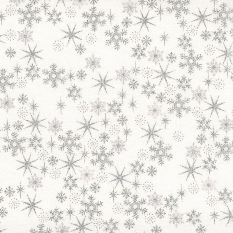 Off-white fabric with scattered snowflakes and stars with silver metallic accents.