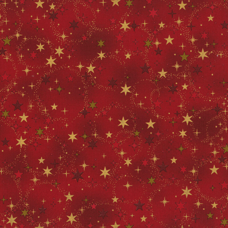 Mottled red fabric with scattered, stylized stars and lightly dotted circles with gold metallic accents.