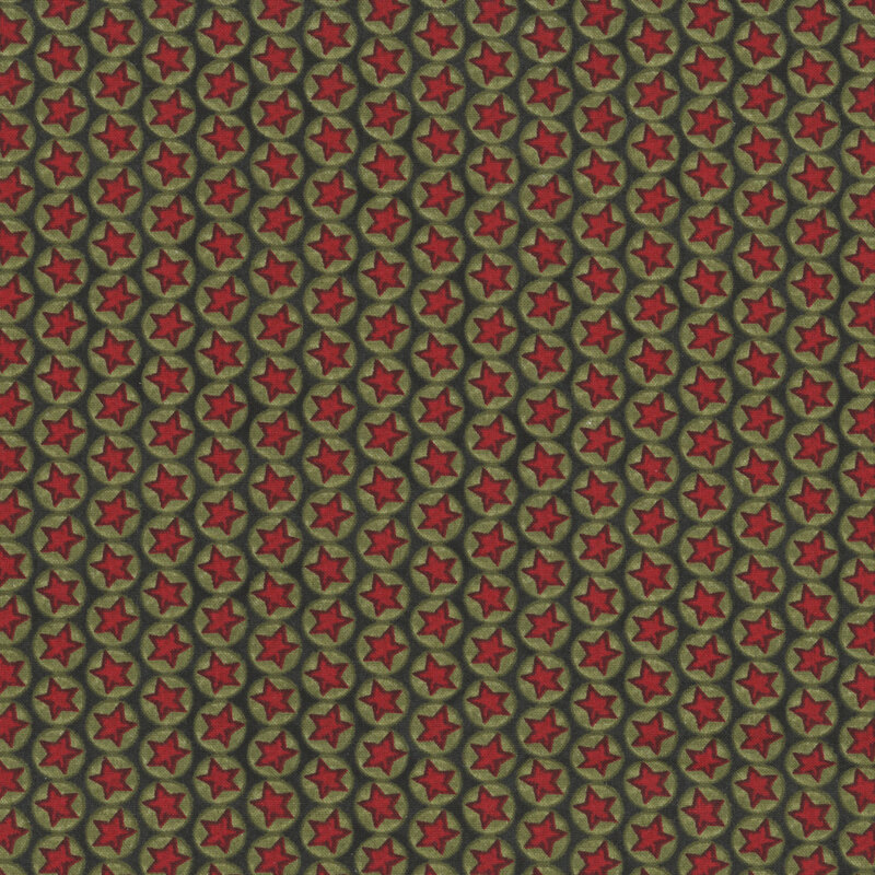 Black fabric with lines of green circles with red stars in the center
