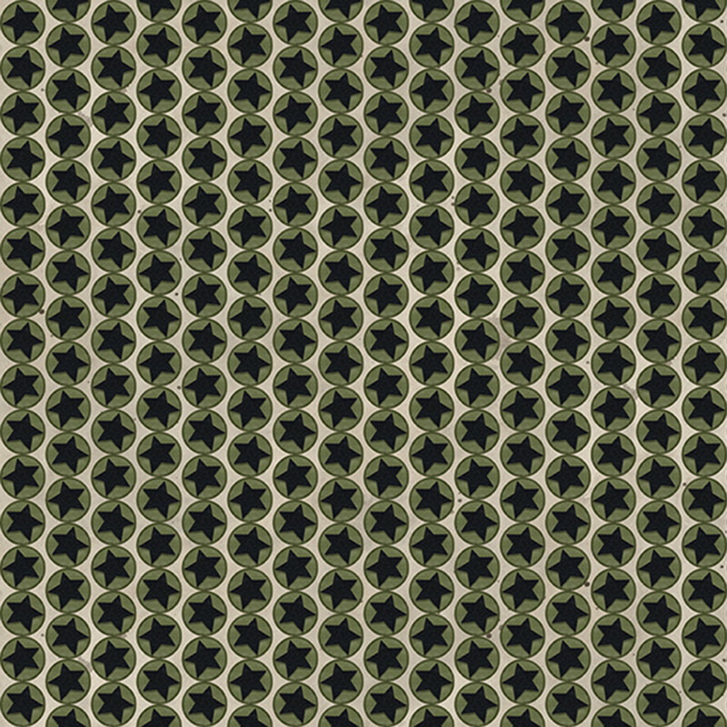 Greige fabric with lines of green circles and black stars in the center
