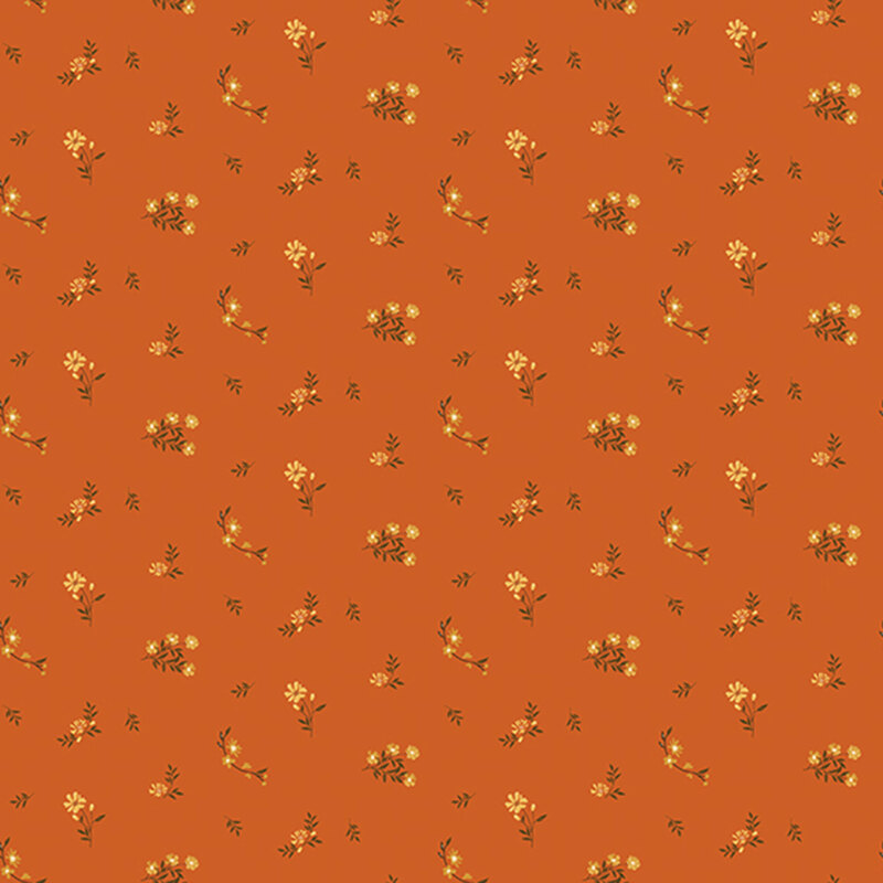 Pumpkin orange fabric with a ditsy print of yellow flowers and brown twigs
