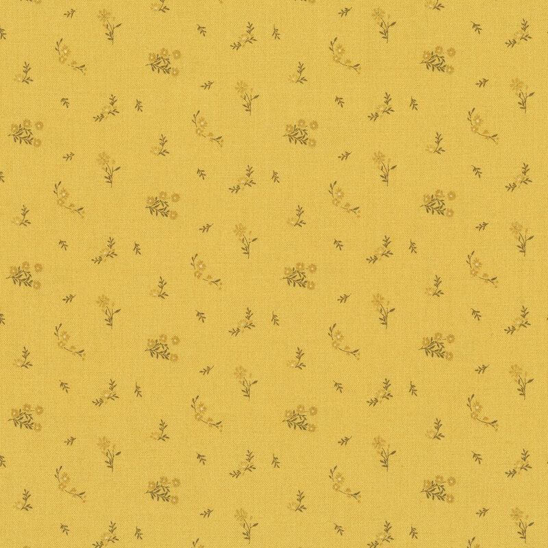 Honey yellow fabric with a ditsy print of gold flowers and brown twigs