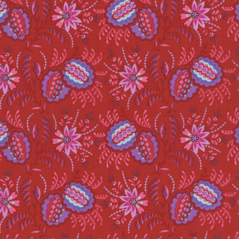 Red fabric featuring elaborate clusters of flowers and leaves in bright pink, purple, and aqua.