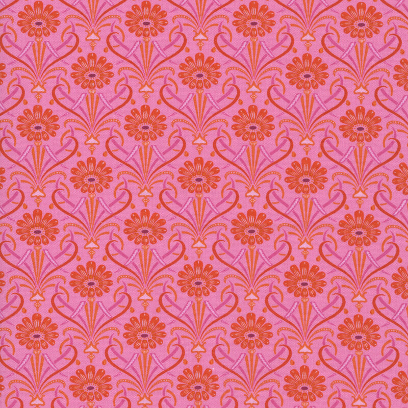 Hot pink fabric featuring large bright orange flowers with ornate leaves of red and purple.