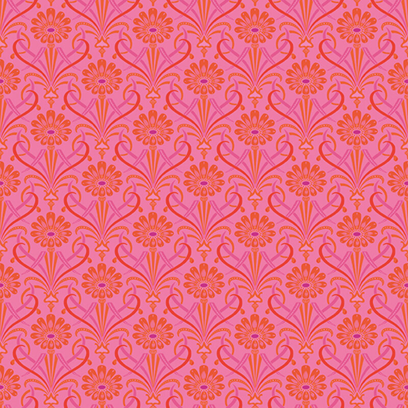 Hot pink fabric featuring large bright orange flowers with ornate leaves of red and purple.