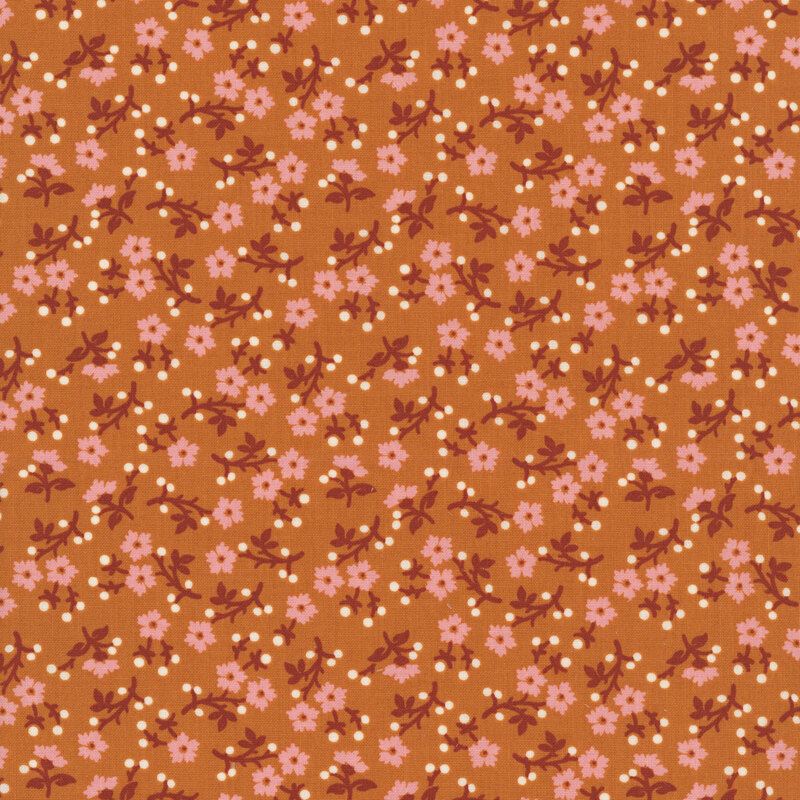 Copper orange fabric with dense, scattered pastel pink florals with red stems and white dots