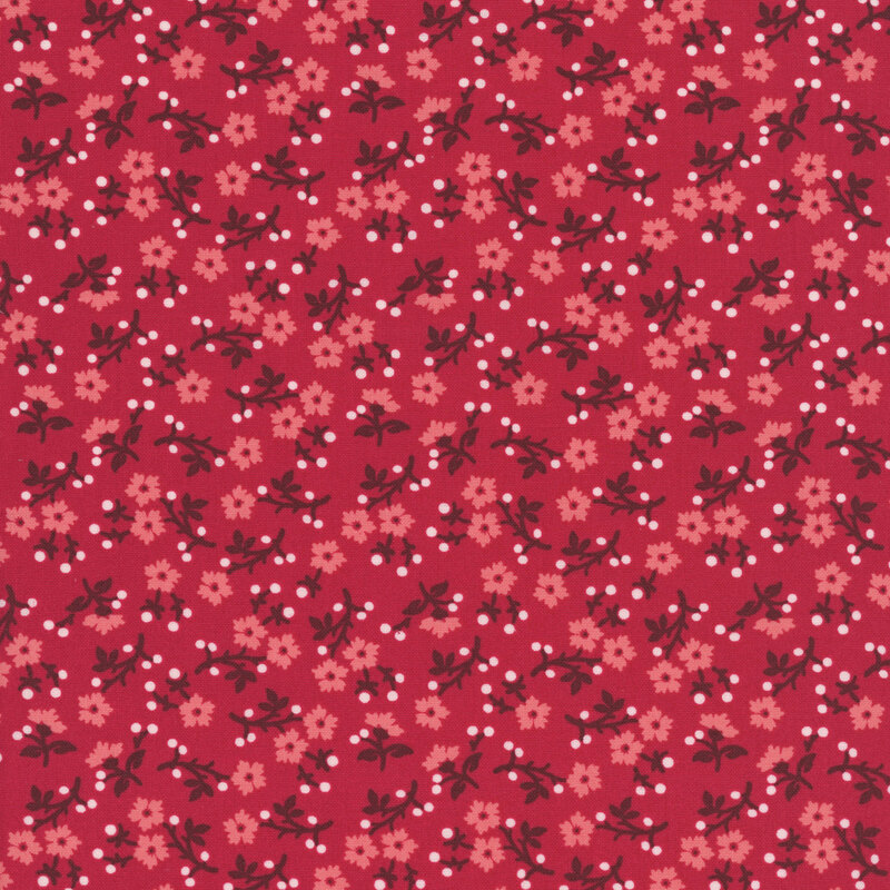 Scarlet fabric with dense, scattered salmon pink florals with dark red stems and white dots