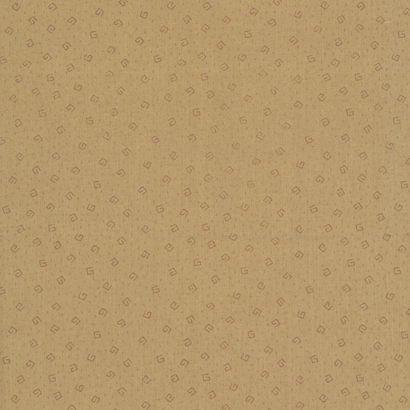 Geometric brown swirls and beige dashes on a dark tan fabric 