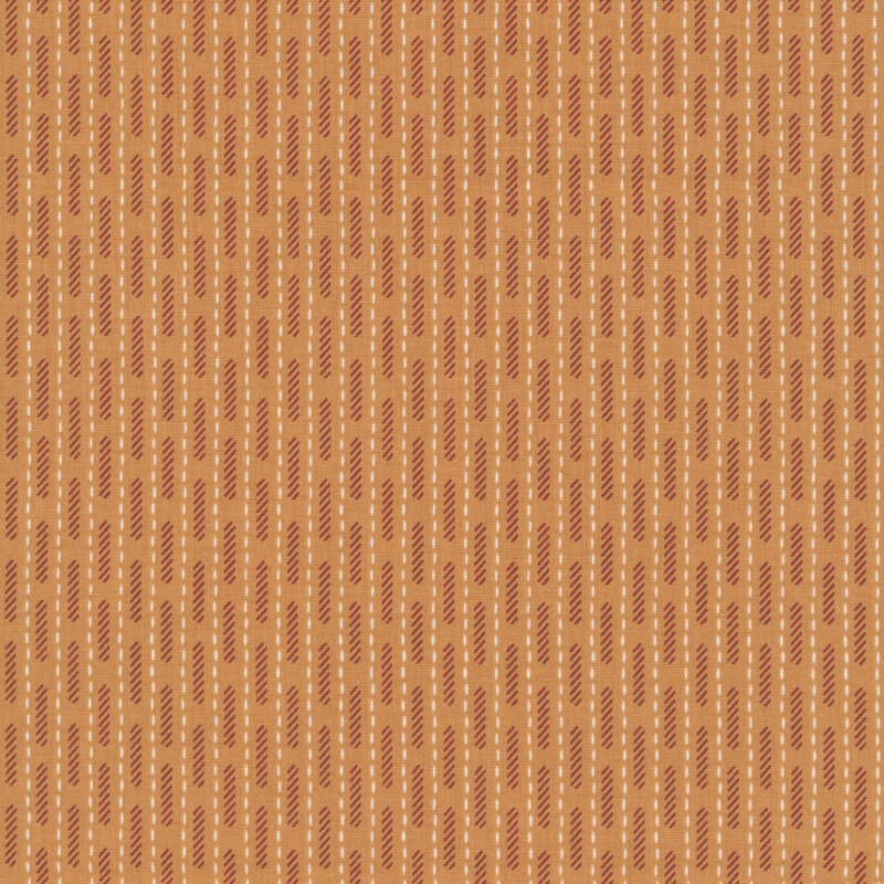 Peach fabric with vertical white dashes and a pattern of brick red lines