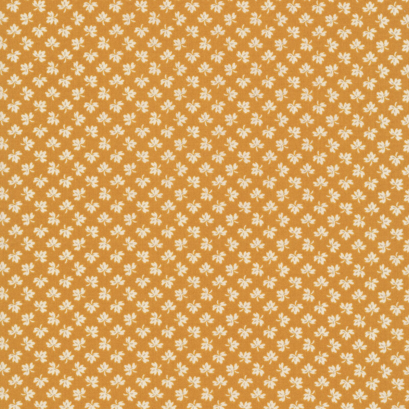 Butterscotch yellow background with ditsy cream leaf pattern