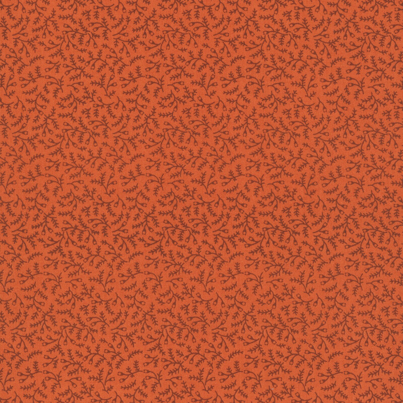 Pumpkin orange fabric with a dense pattern of dark orange vines