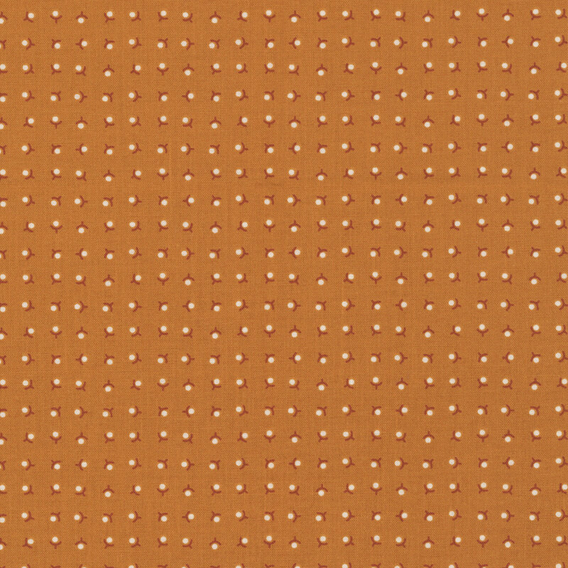 Dark gold background with a ditsy pattern of white minimalistic flowers and dark red stems