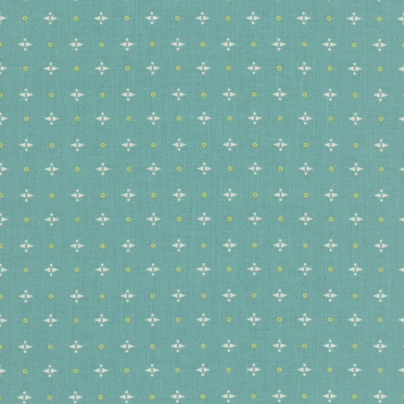 Teal fabric with a geometric white shapes and yellow circles