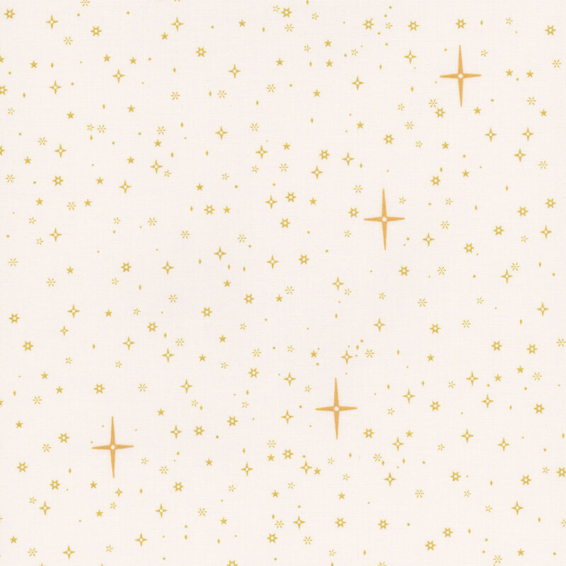 Cream fabric tossed with gold stars.