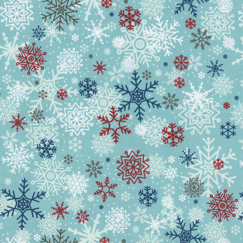 Aqua fabric with a pattern of large snowflakes in blue, white, and red.