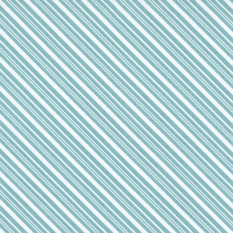 White fabric with a diagonal pattern of aqua stripes in varying widths.
