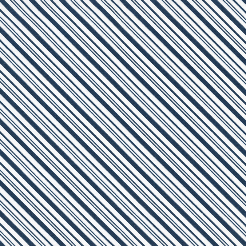 White fabric with a diagonal pattern of navy stripes in varying widths.