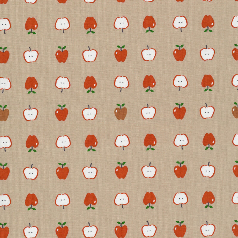 Taupe brown fabric with neat rows of red and gold apples both full and cut in half.