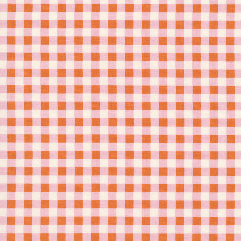Gingham fabric with pink, white, and orange squares.