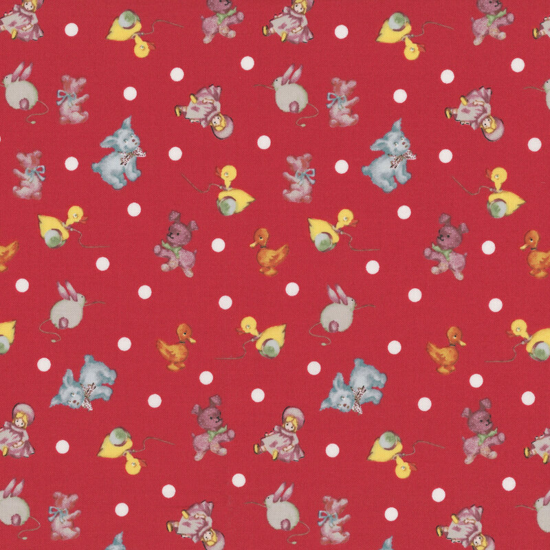 Red fabric with white polka dots and tossed duck pull toys, dolls, plush dogs, and baby ducks.