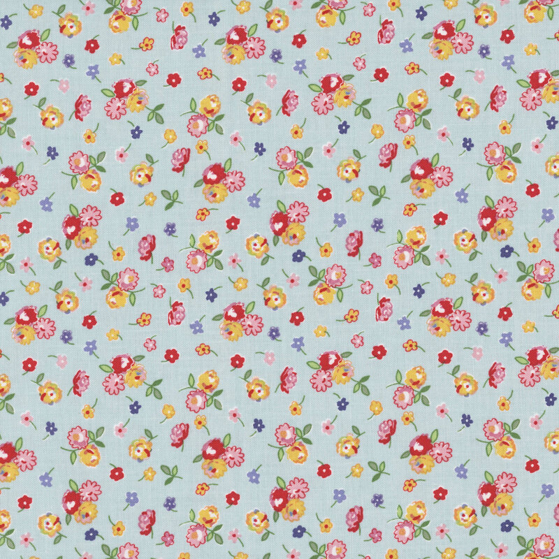 Light blue fabric with small clusters of red, pink, blue, and yellow flowers.
