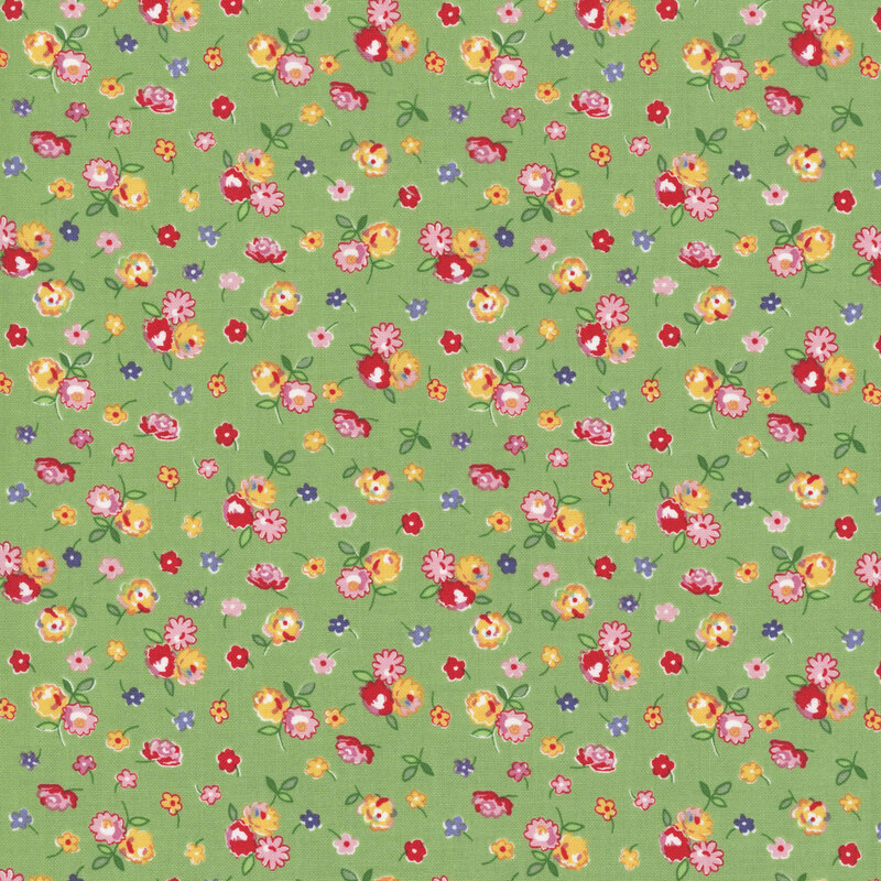Green fabric with small clusters of red, pink, blue, and yellow flowers.