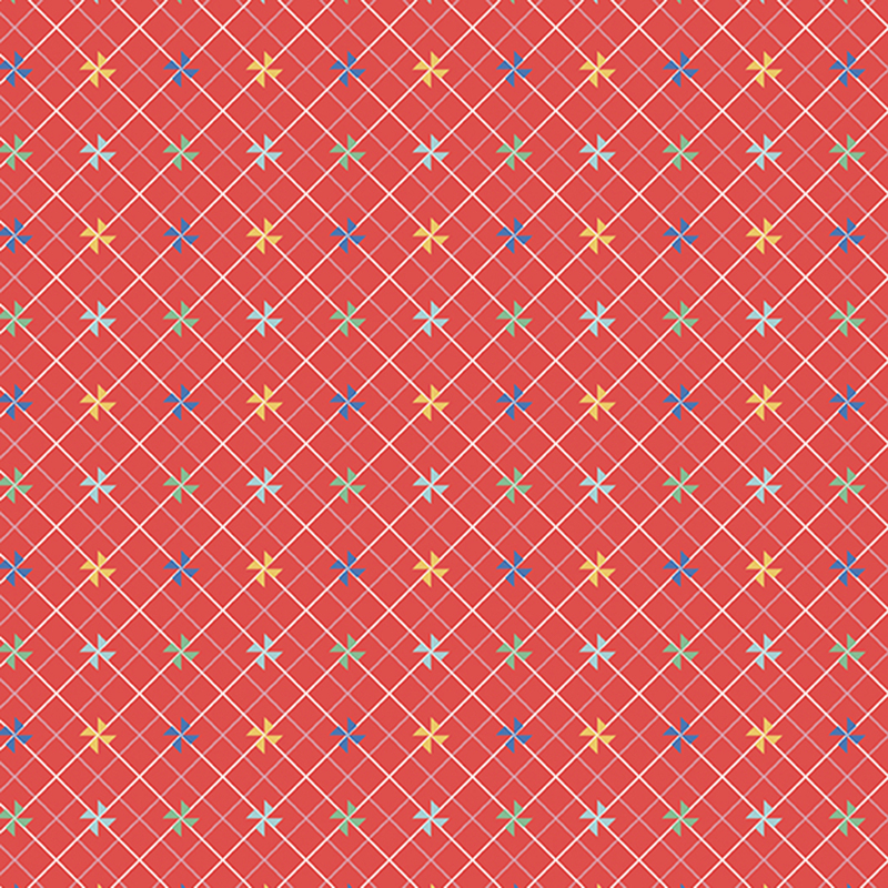 Red fabric with small colored pinwheels on a white and pink lattice background.