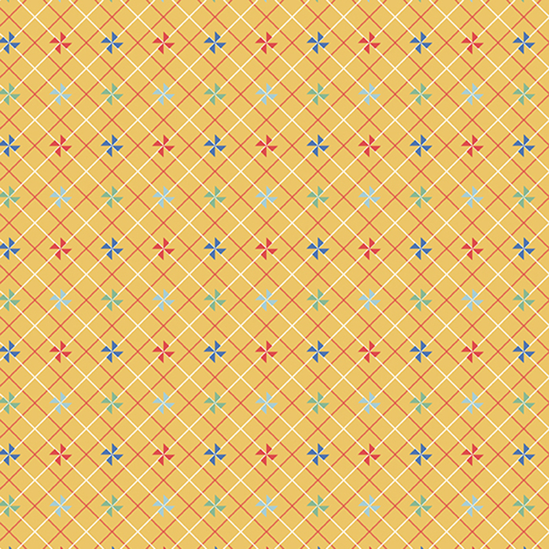 Golden yellow fabric with small colored pinwheels on a white and red lattice background.