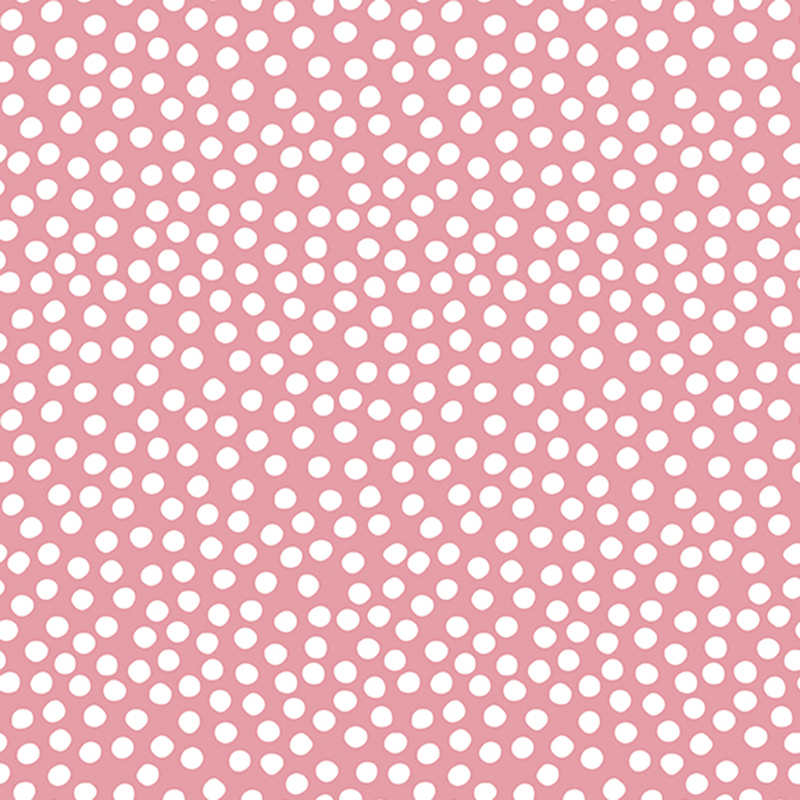 Dusty pink fabric with uneven white polka dots clustered together.