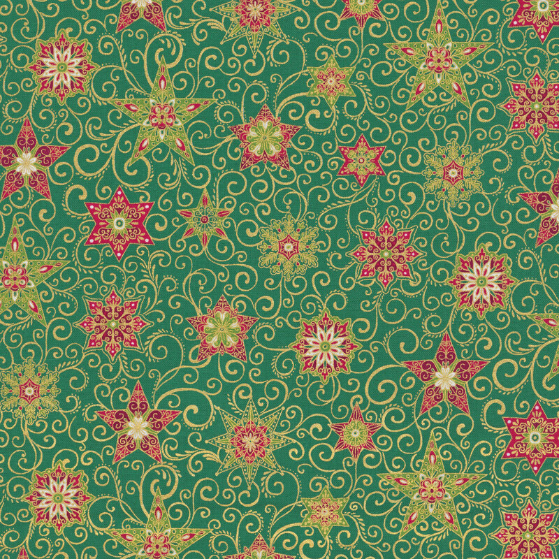 A green fabric with decorated stars, snowflakes, swirls, and gold metallic accents. 