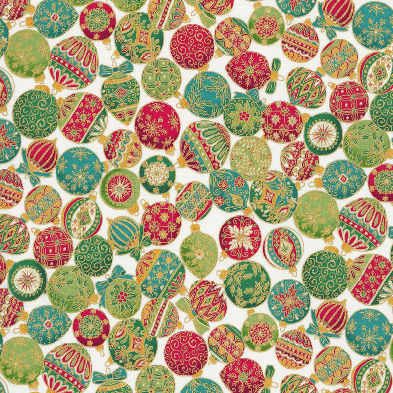A cream fabric with packed decorated christmas ornaments and gold metallic accents. 