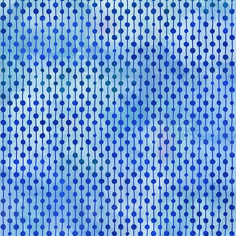 blue beaded strings on a mottled iris blue fabric
